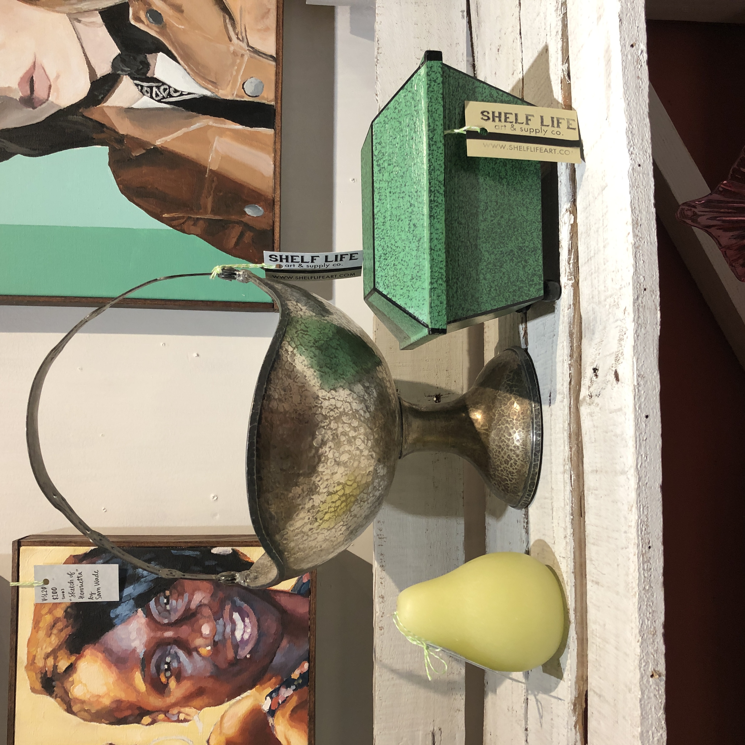 Oil portraits by Sam Wade, boutique green pear candle, vintage silver basket, and handpainted wooden box at Shelf Life Satellite. 